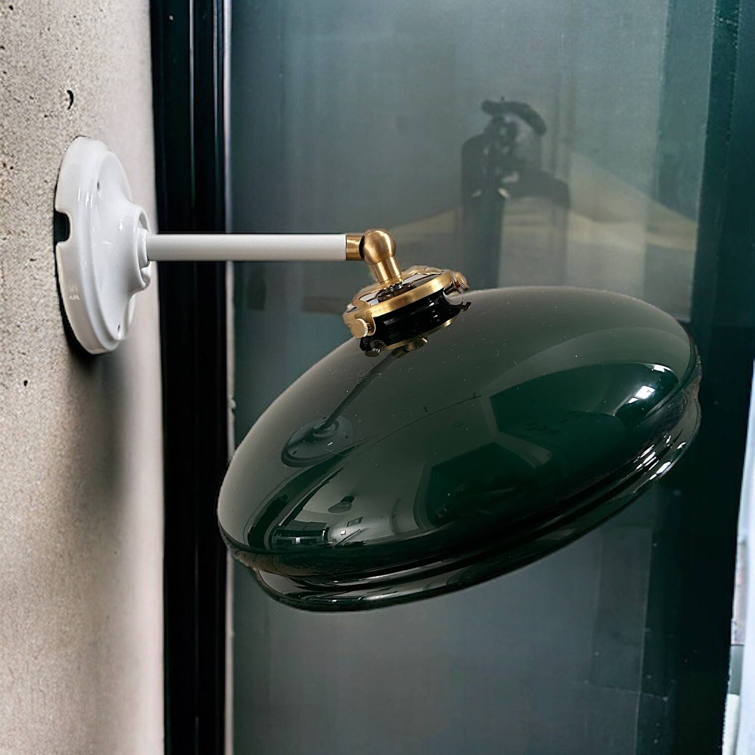 Tilting wall light in green opaline