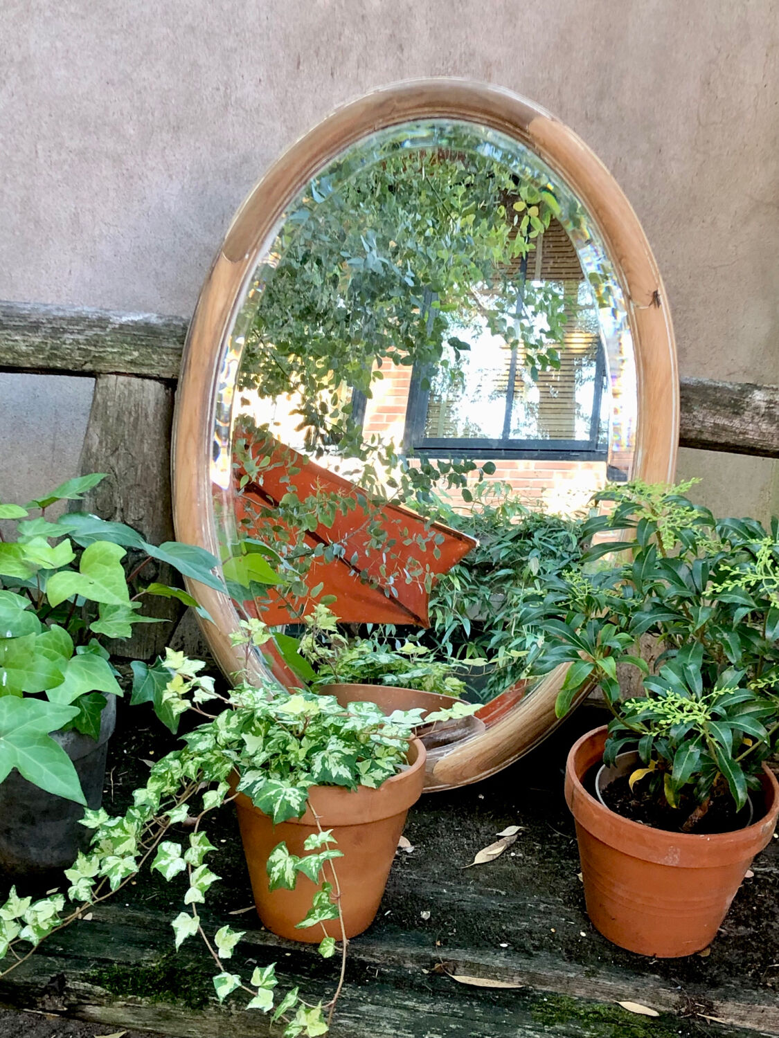 Oval wooden mirror