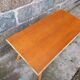 Rattan coffee table with compass legs