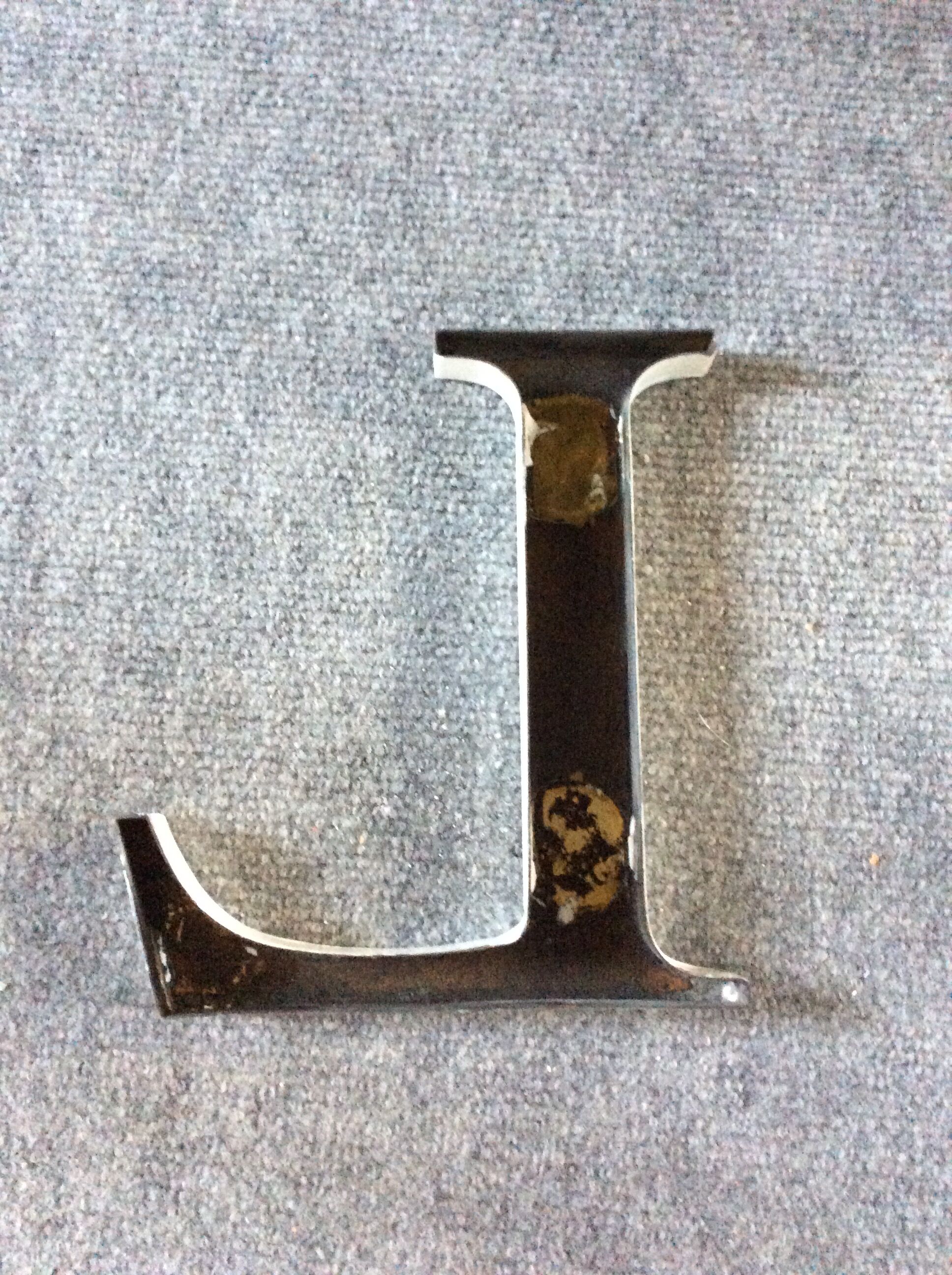 Brass sign letter