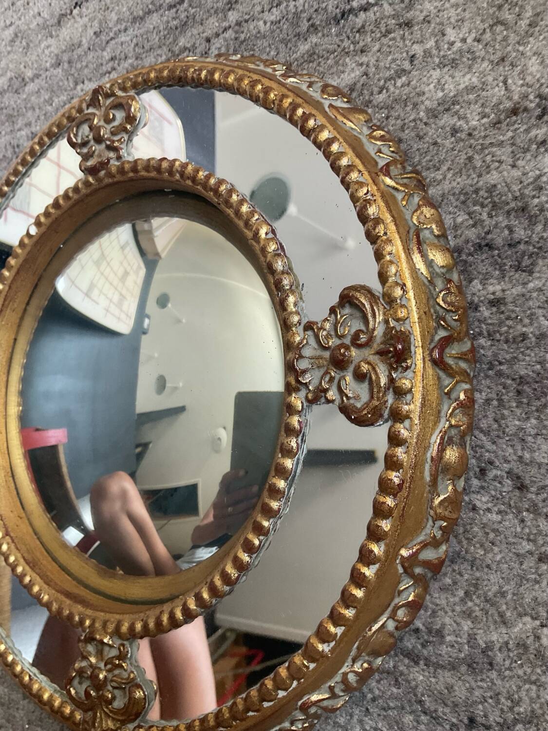 Antique domed witch's eye mirror in gilded wood