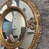 Antique domed witch's eye mirror in gilded wood