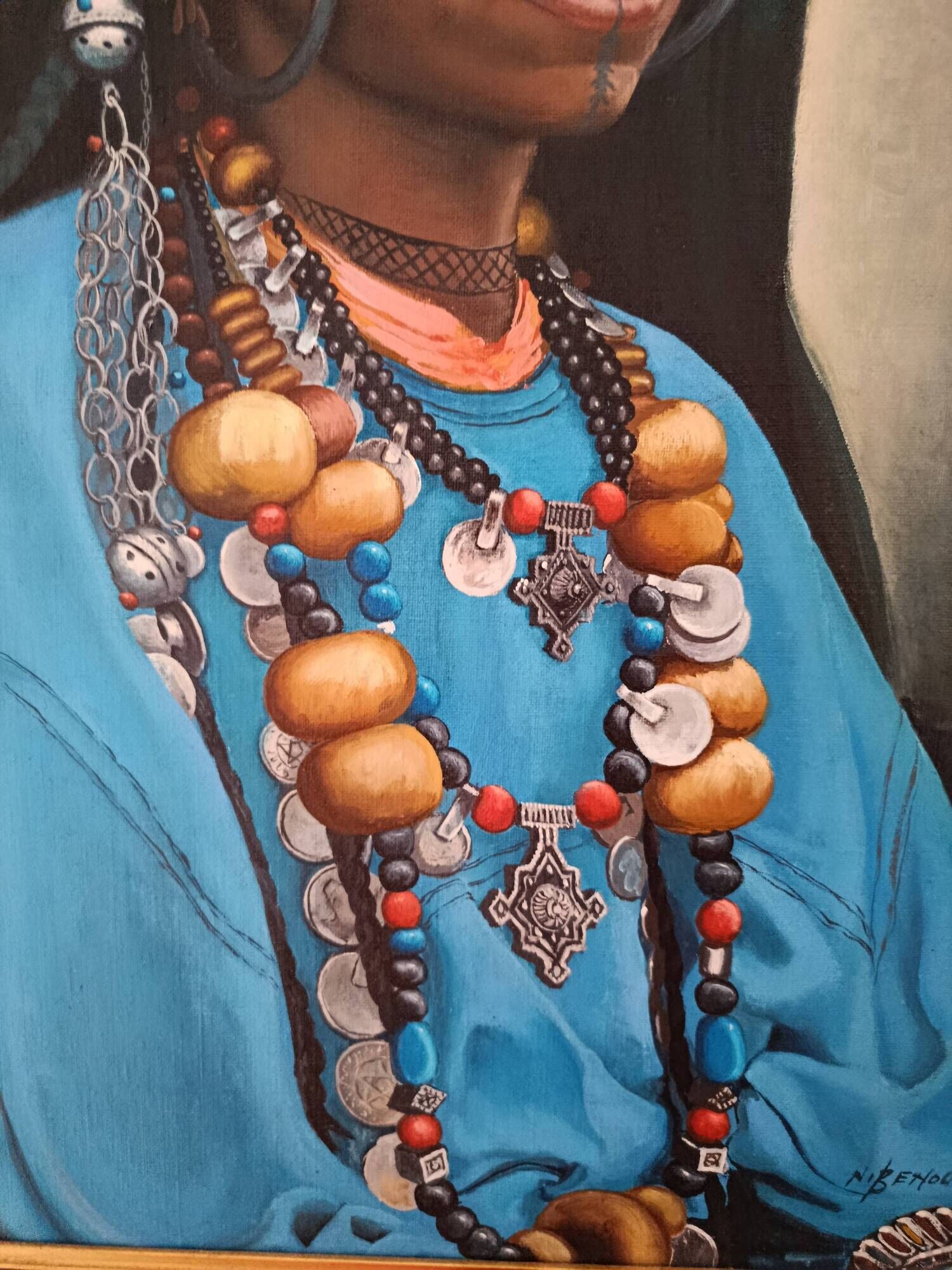 Portrait of a young Moroccan woman in traditional attire and adornments.