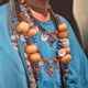 Portrait of a young Moroccan woman in traditional attire and adornments.