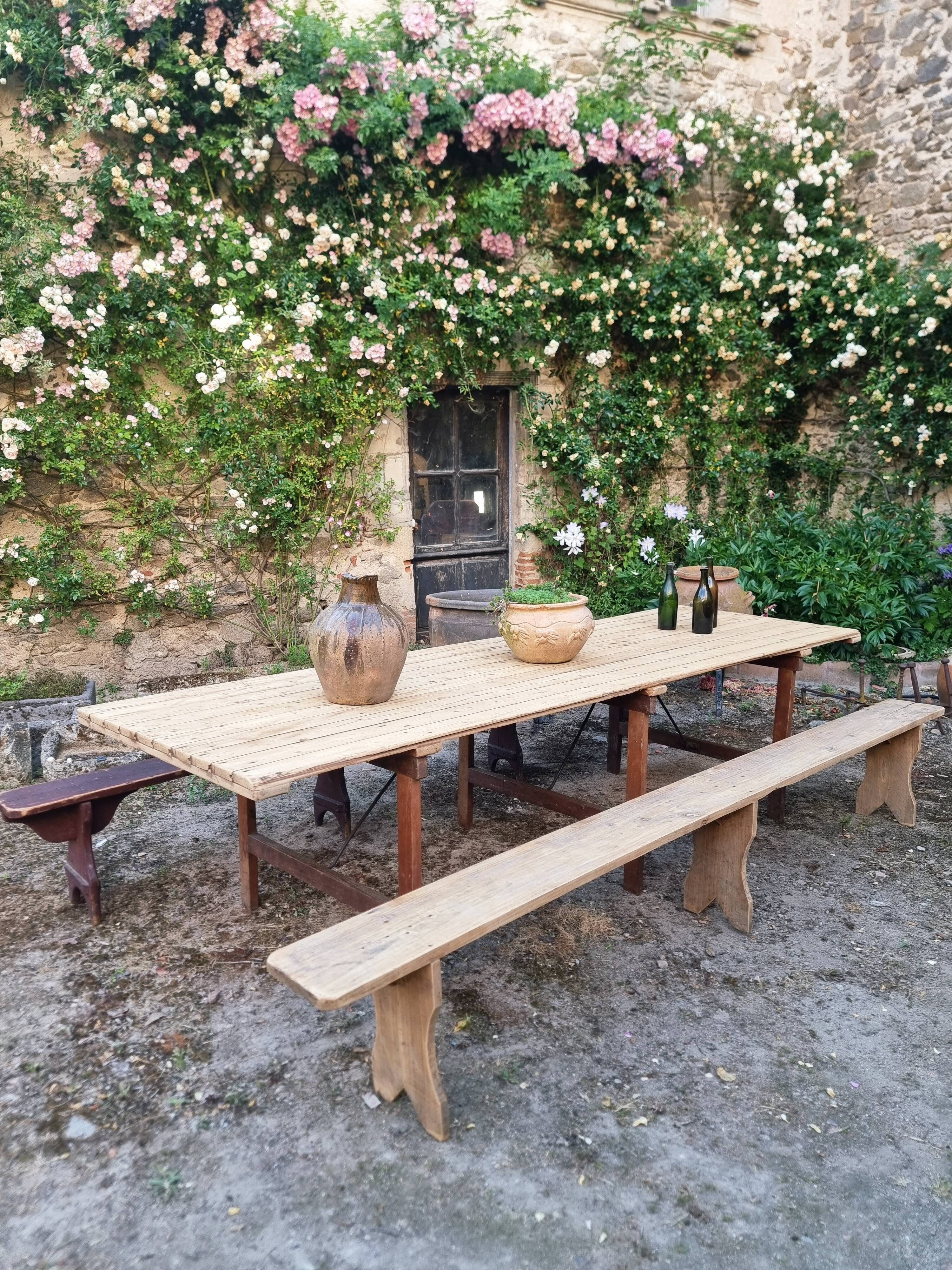 Antique French folding garden table set with benches, pine and chestnut, circa 1900–1920.