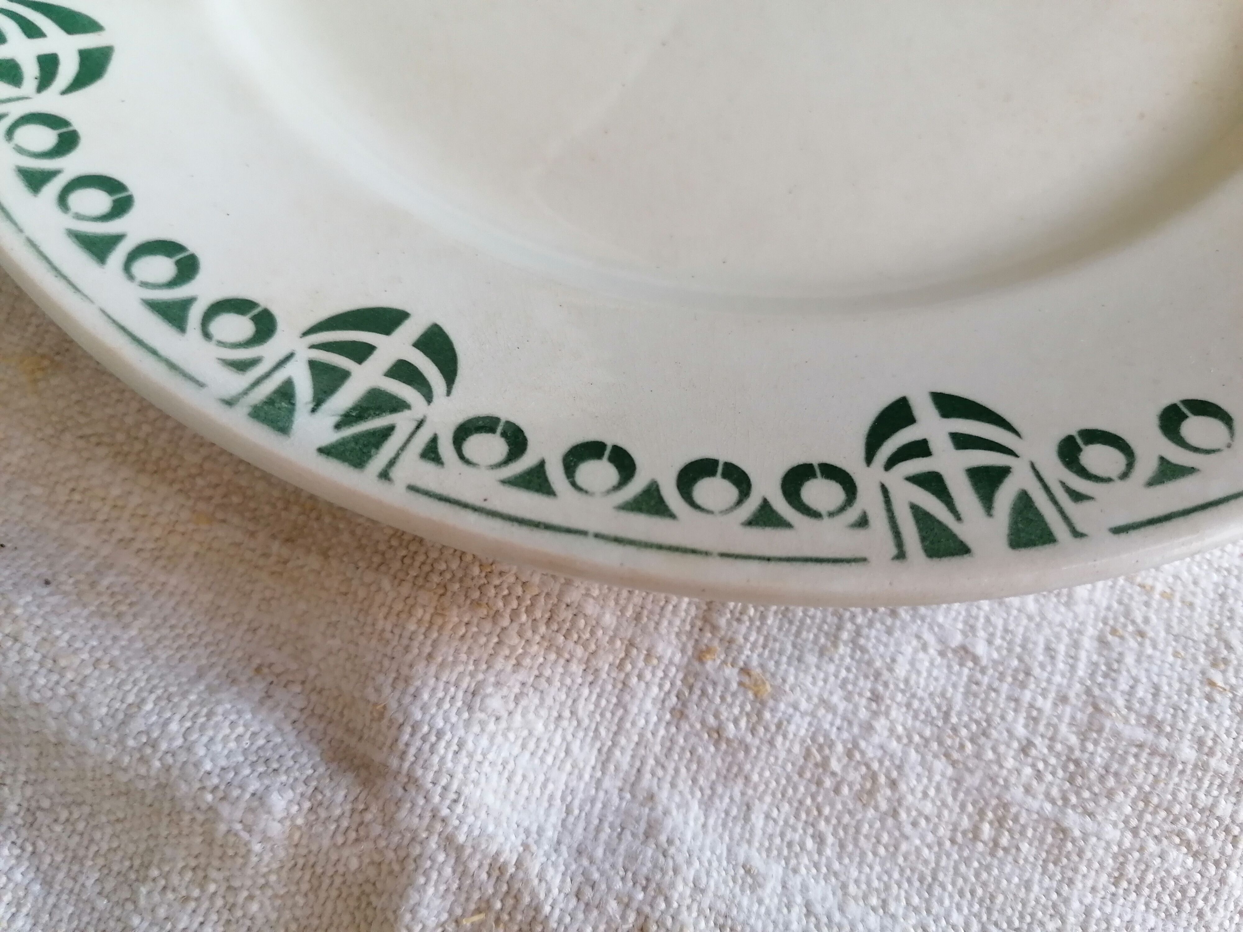 Set of 11 flat earthenware plates