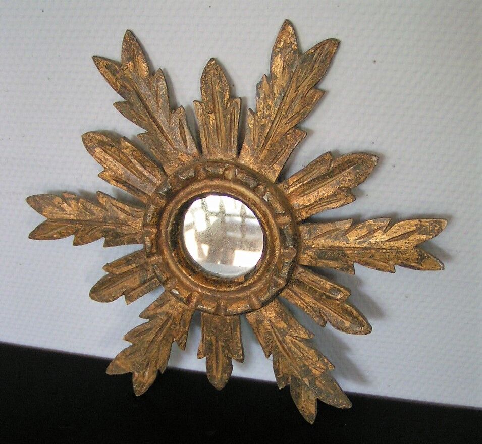 Sun mirror in gilded wood