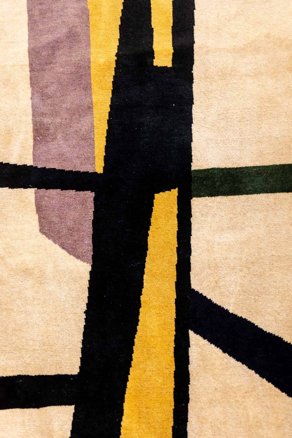 Handwoven wool tapestry with colourful geometric design. 2026.