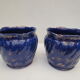 Pair of cache-old pots in midnight blue and gold ceramic