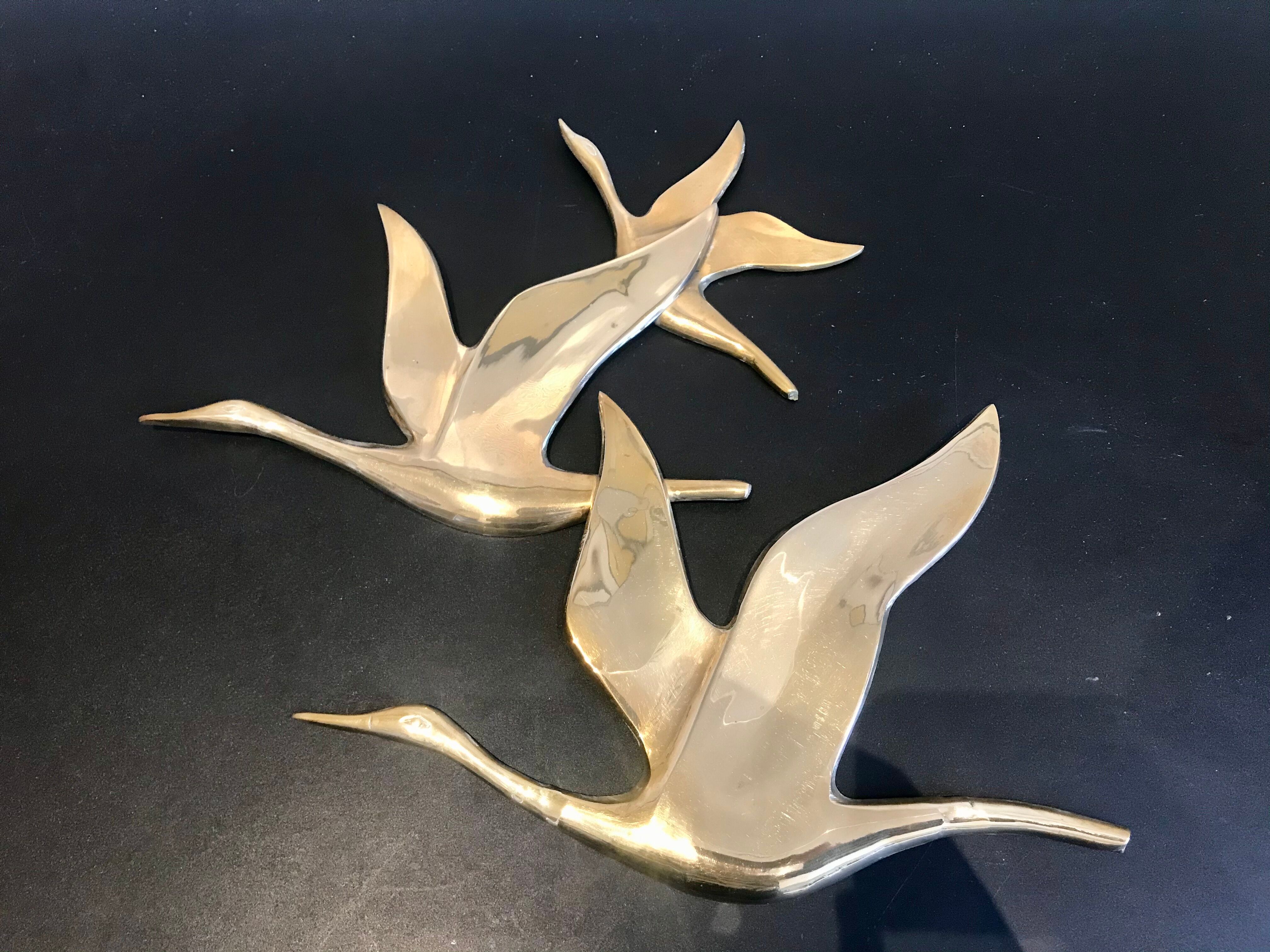 Birds in brass flight