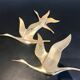 Birds in brass flight