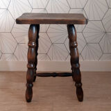 Brown turned wooden stool.