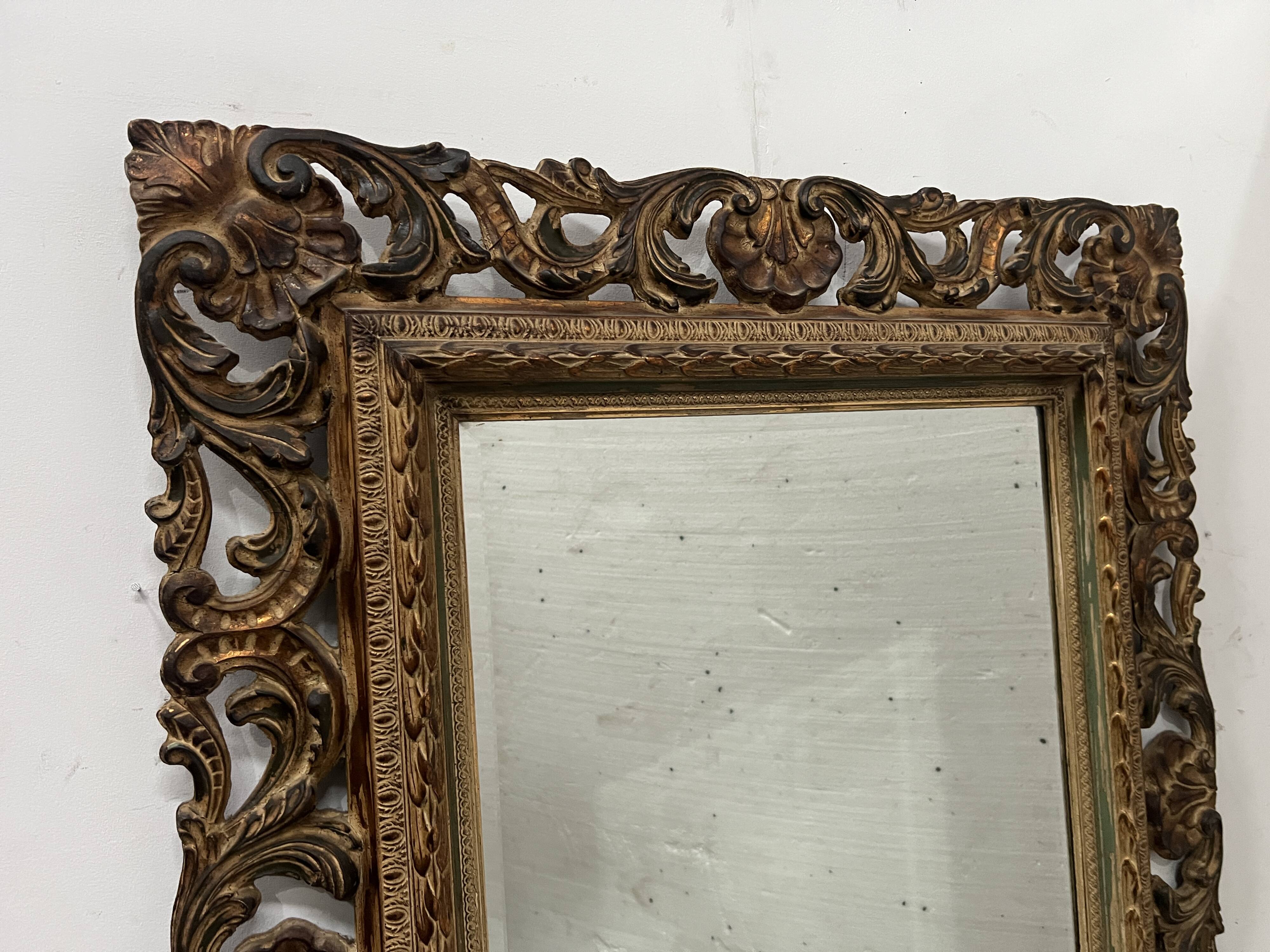 Napoleon III style mirror in carved wood, 20th century.
