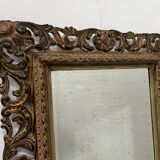 Napoleon III style mirror in carved wood, 20th century.