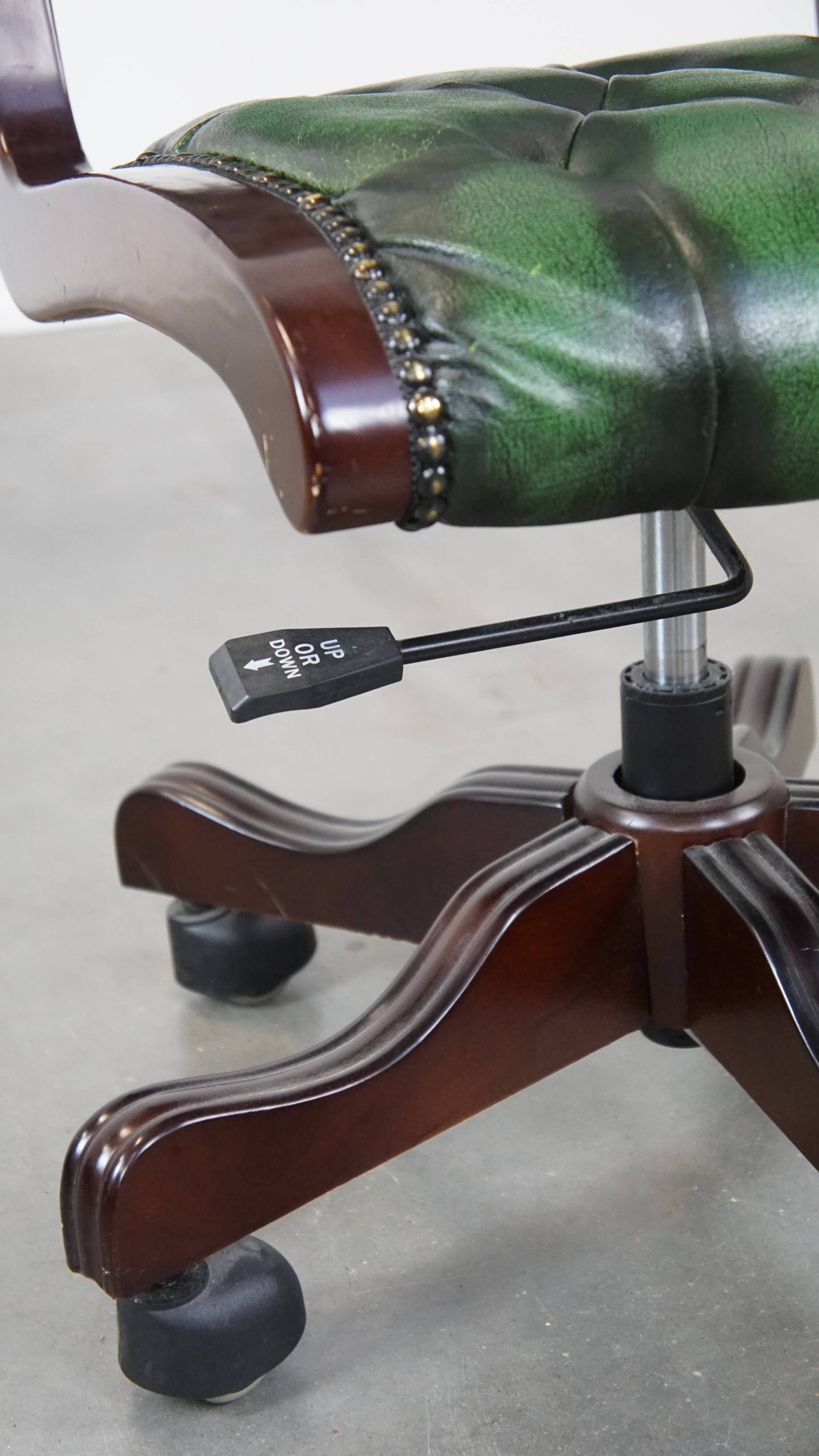 English Chesterfield office chair in green leather, height adjustable on casters