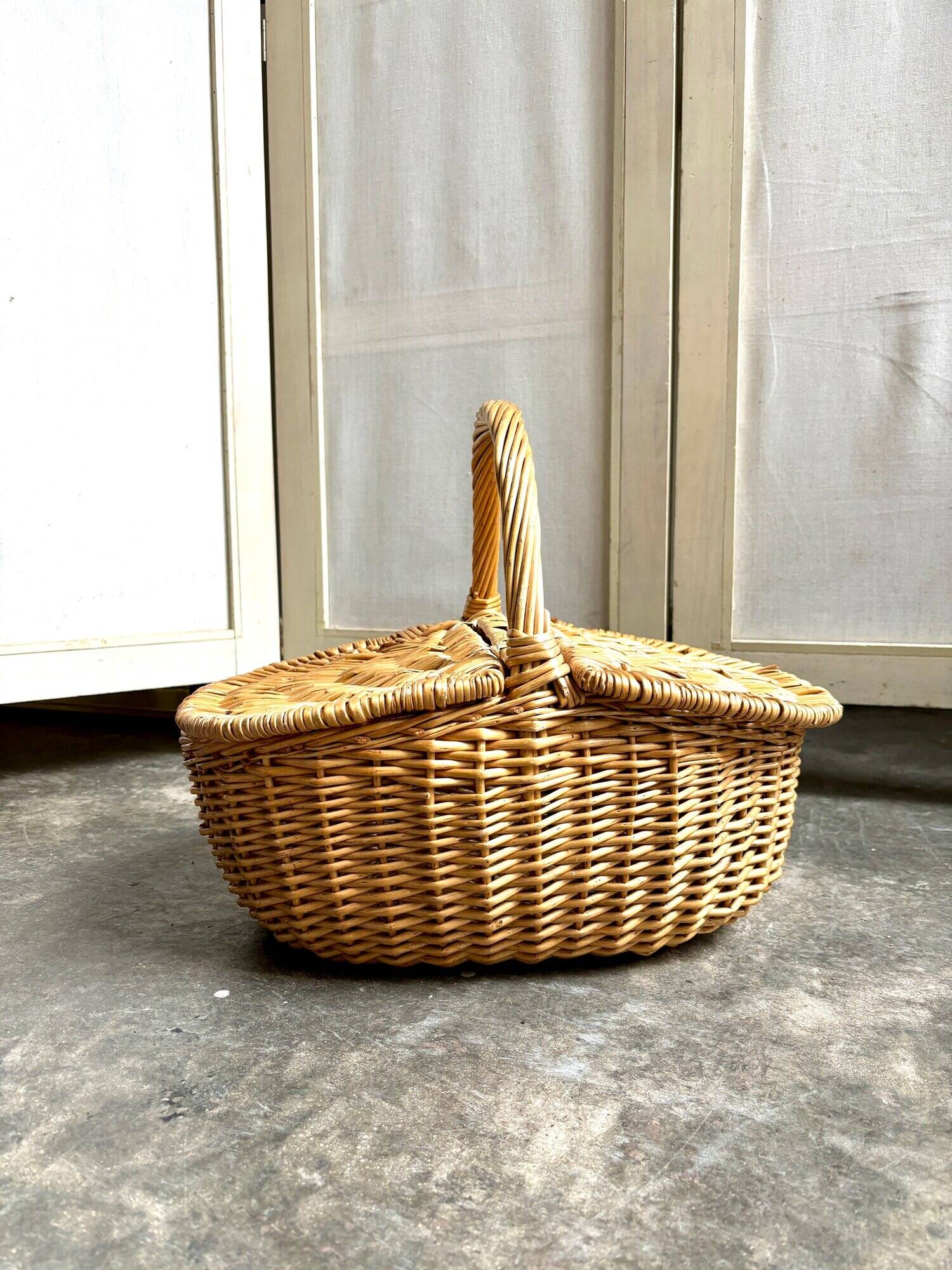 Woven wicker picnic basket