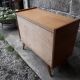 Commode vintage en rotin pieds compas