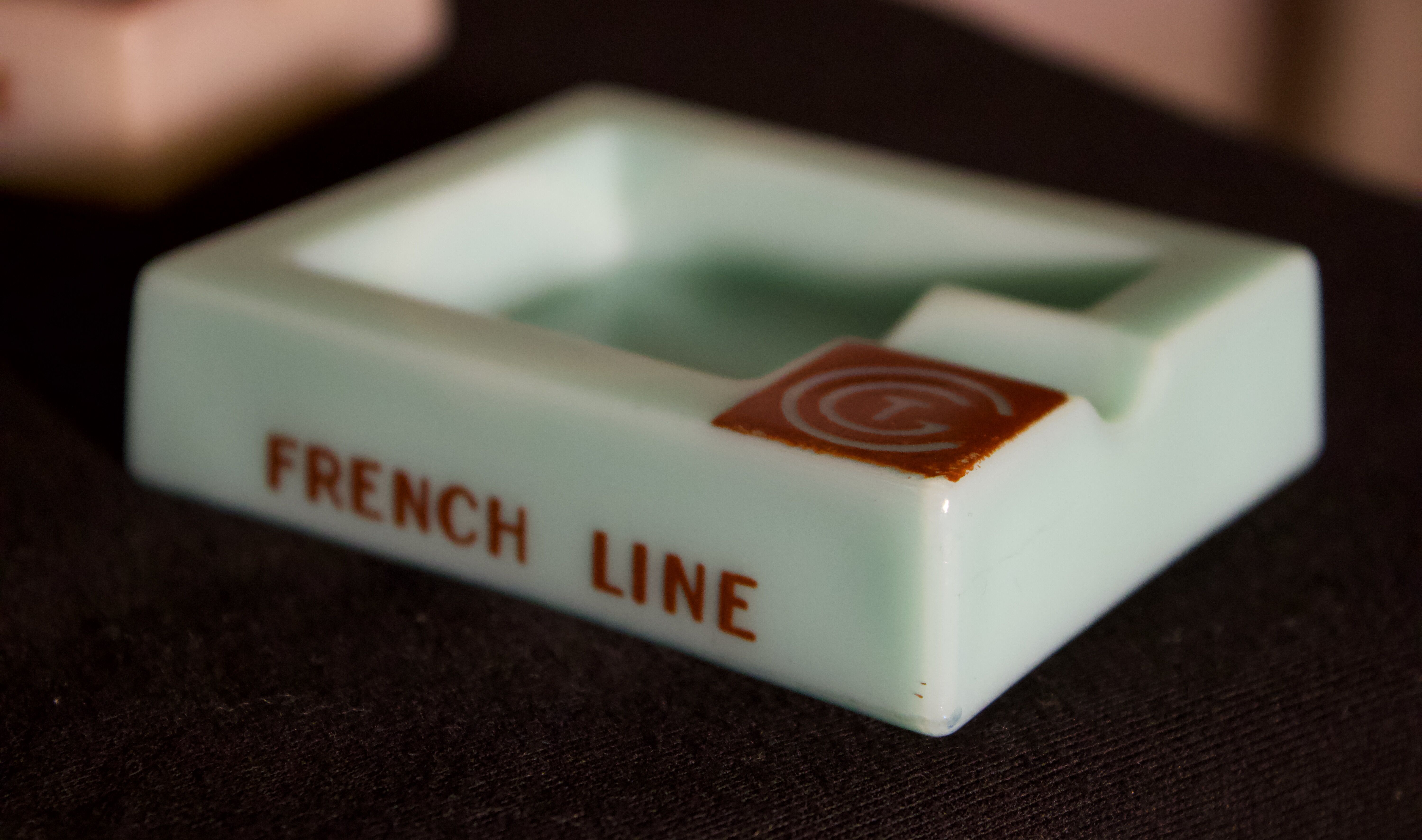 Three opalex ashtrays at the Logo of the Trans-Atlantic General Company - French Line - Model created by Jean Luce for the cruises of the liner Normandy and France