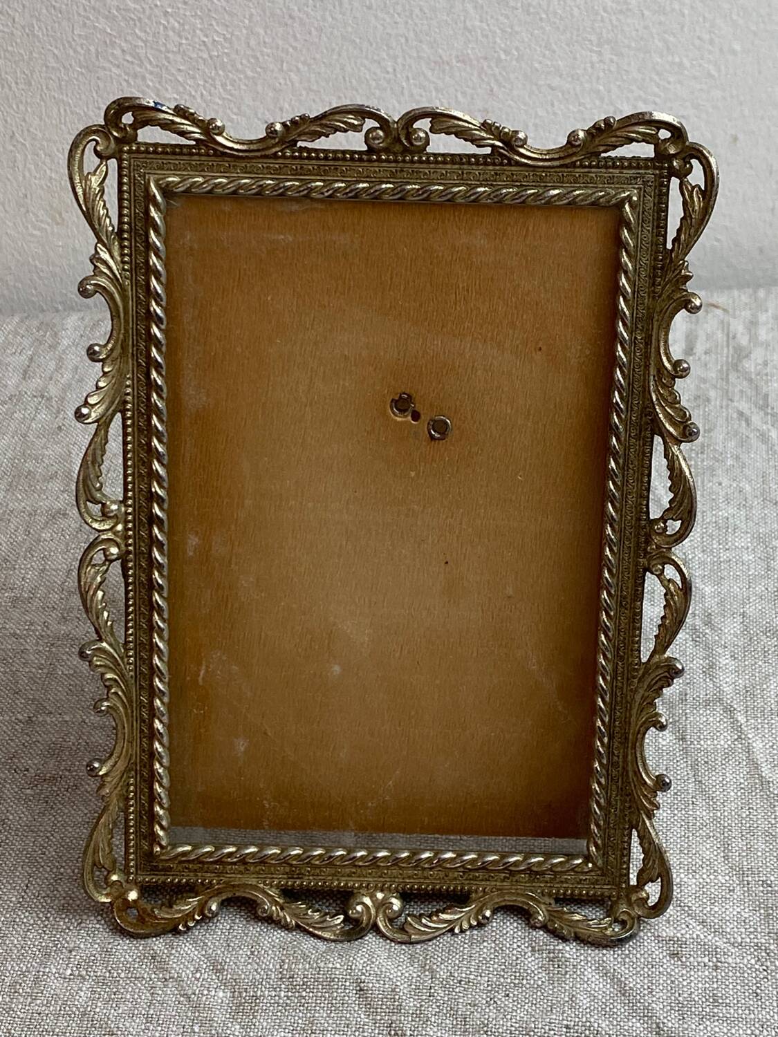 Italian gold metal frame on stand