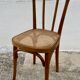 19th-century bistro chair, signed, with caned seat.