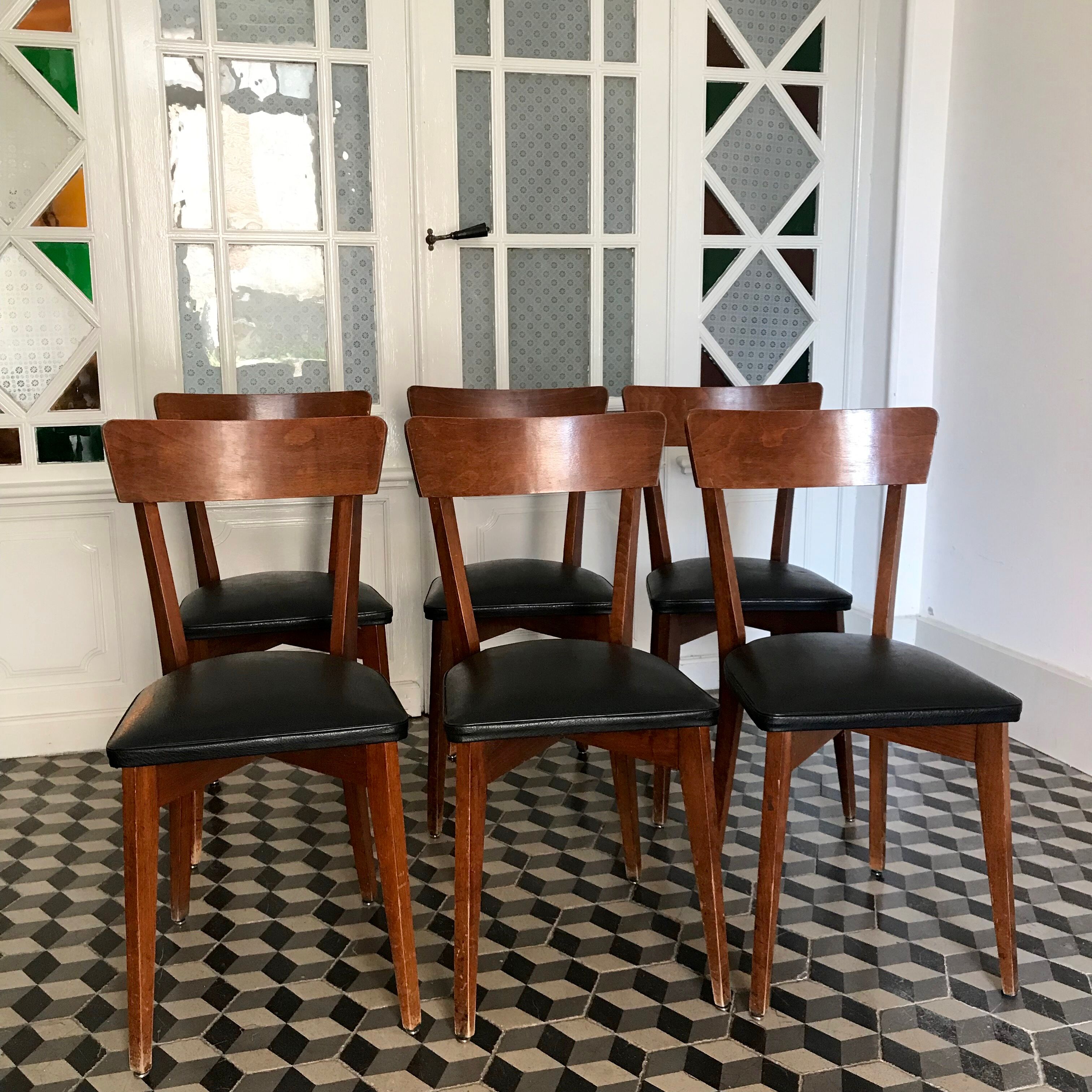 Vintage wooden and black skai chairs