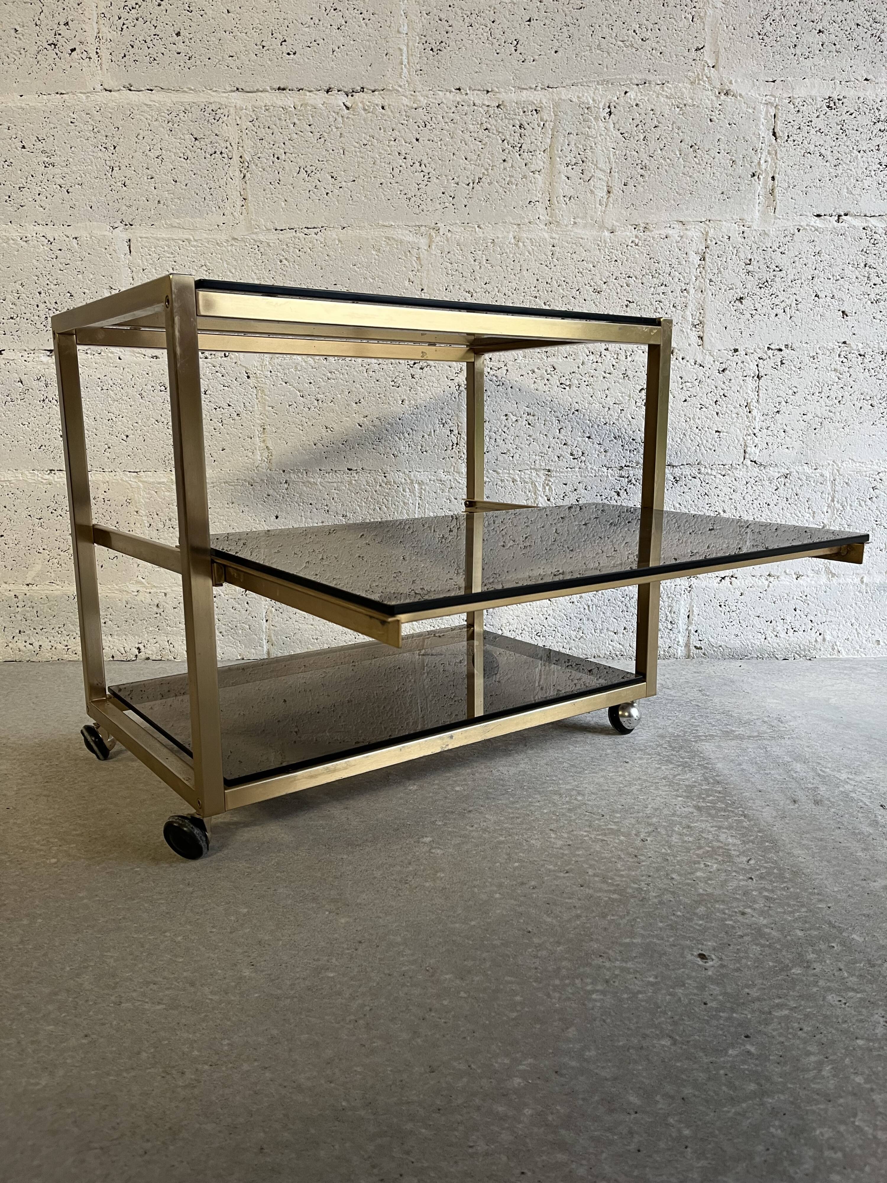 Gold metal and smoked glass serving trolley from the 70s