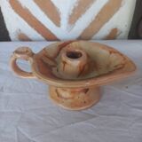 Vintage candle holder in the shape of a stylized Aladdin lamp