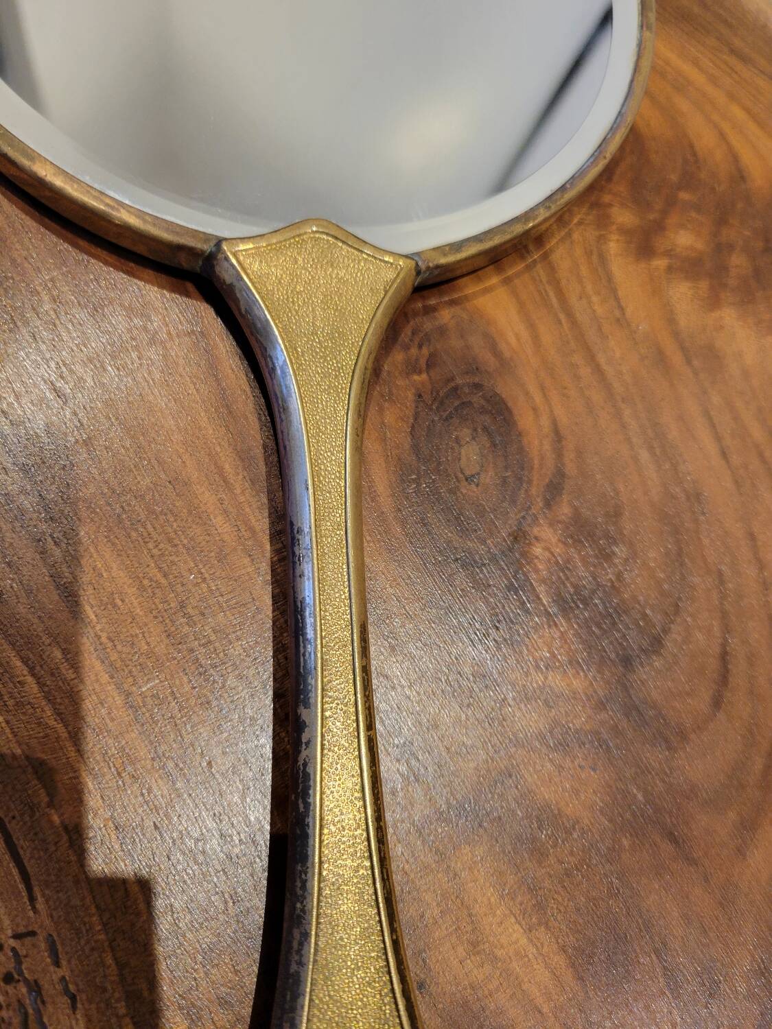 Brass hand mirror with magnifying back
