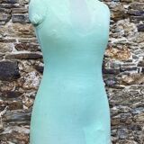 Old mannequin on wooden and fabric stand