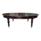 Large English library table in dark walnut with a leather top.