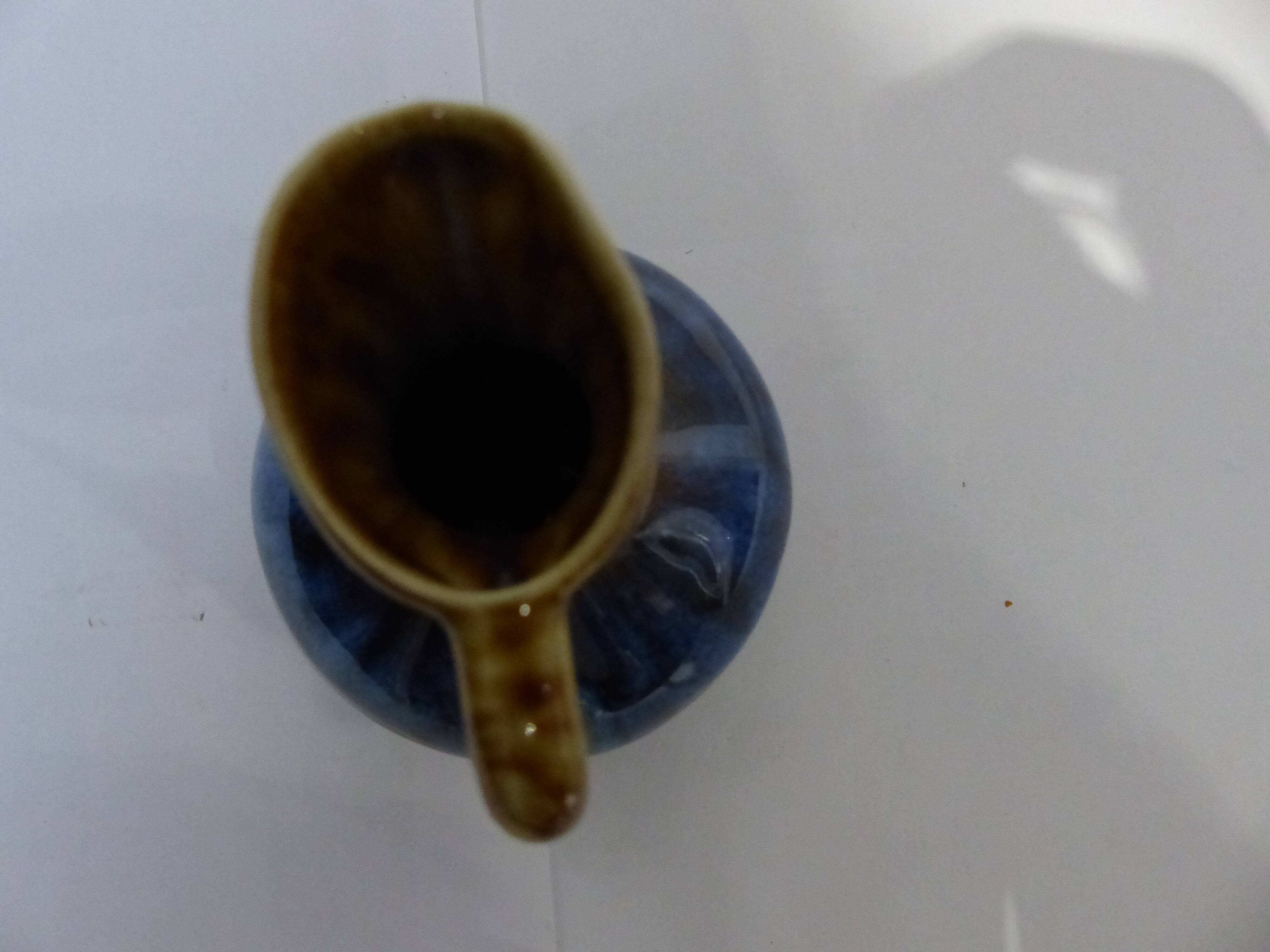 Small vintage ceramic pitcher Blue and brown black reflections