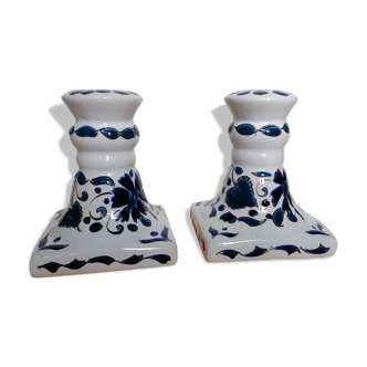 Pair of candle holders decorated in white and blue enamels