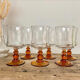 6 small amber-stemmed glasses