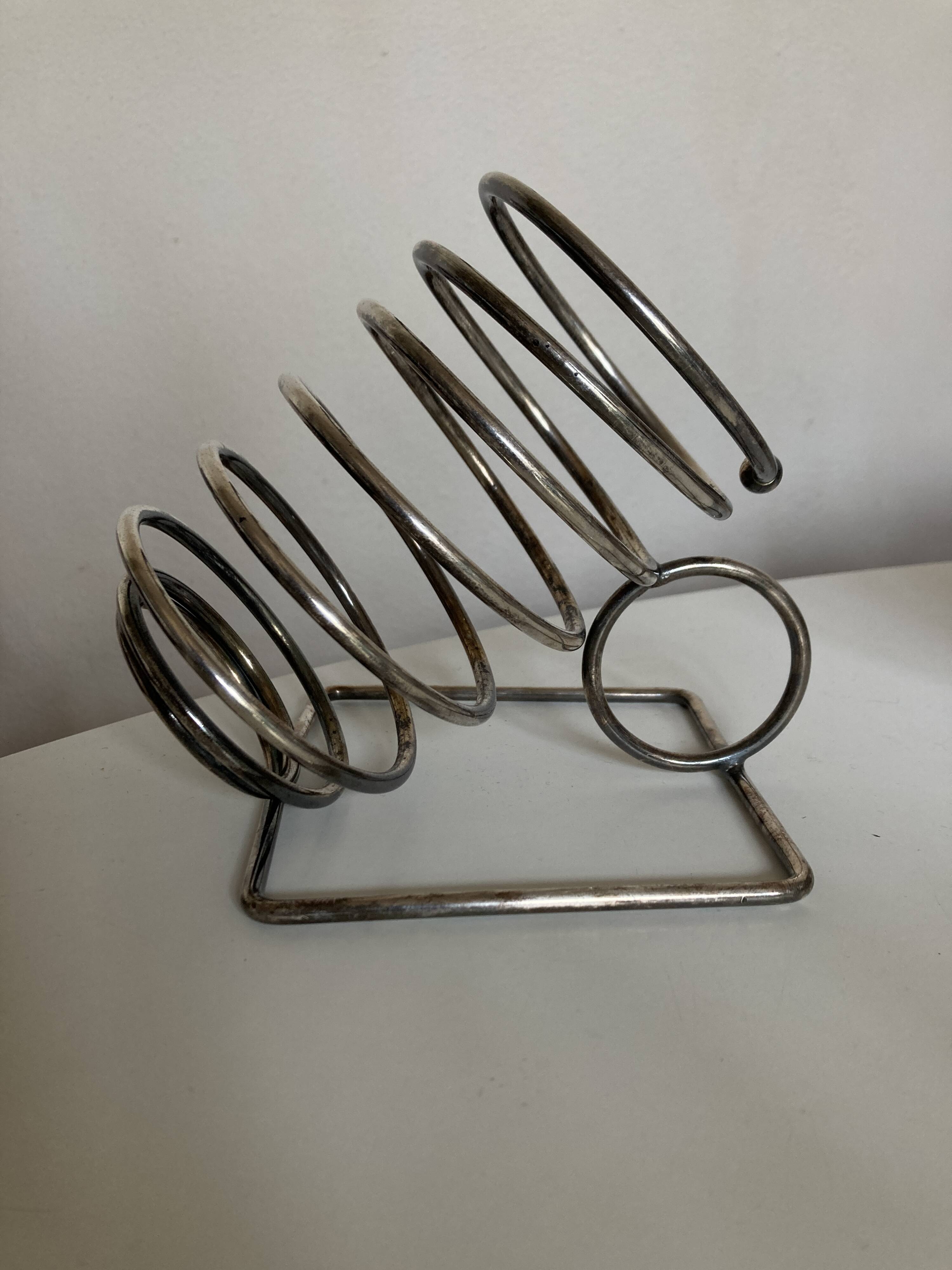 Spring bottle holder in silver metal 1970