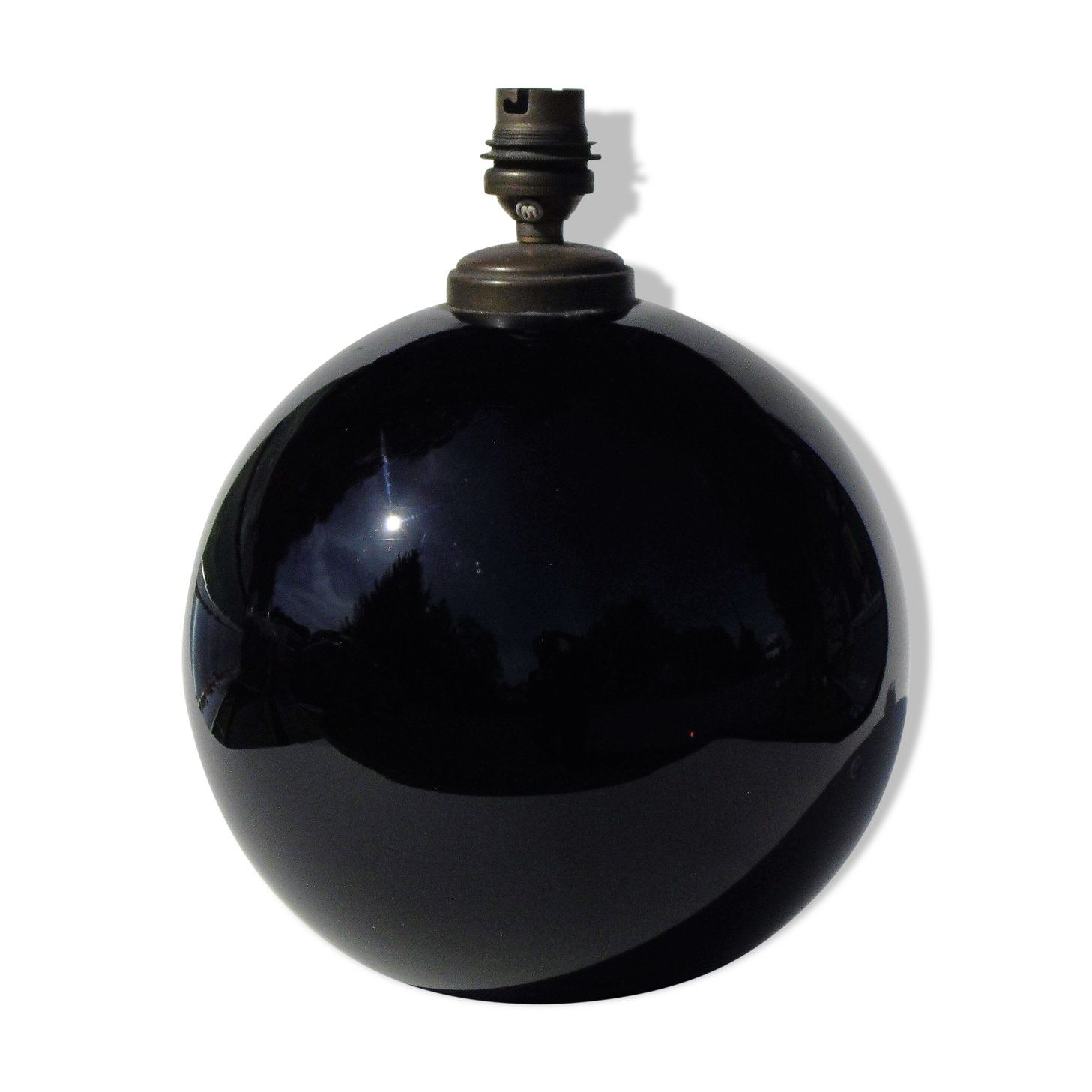 Old lamp foot shaped ball in black glass