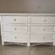 White rattan bedroom set: chest of drawers, mirror, bed, basket