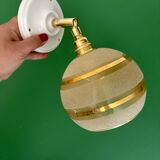 Vintage globe wall light in frosted yellow and gold glass.