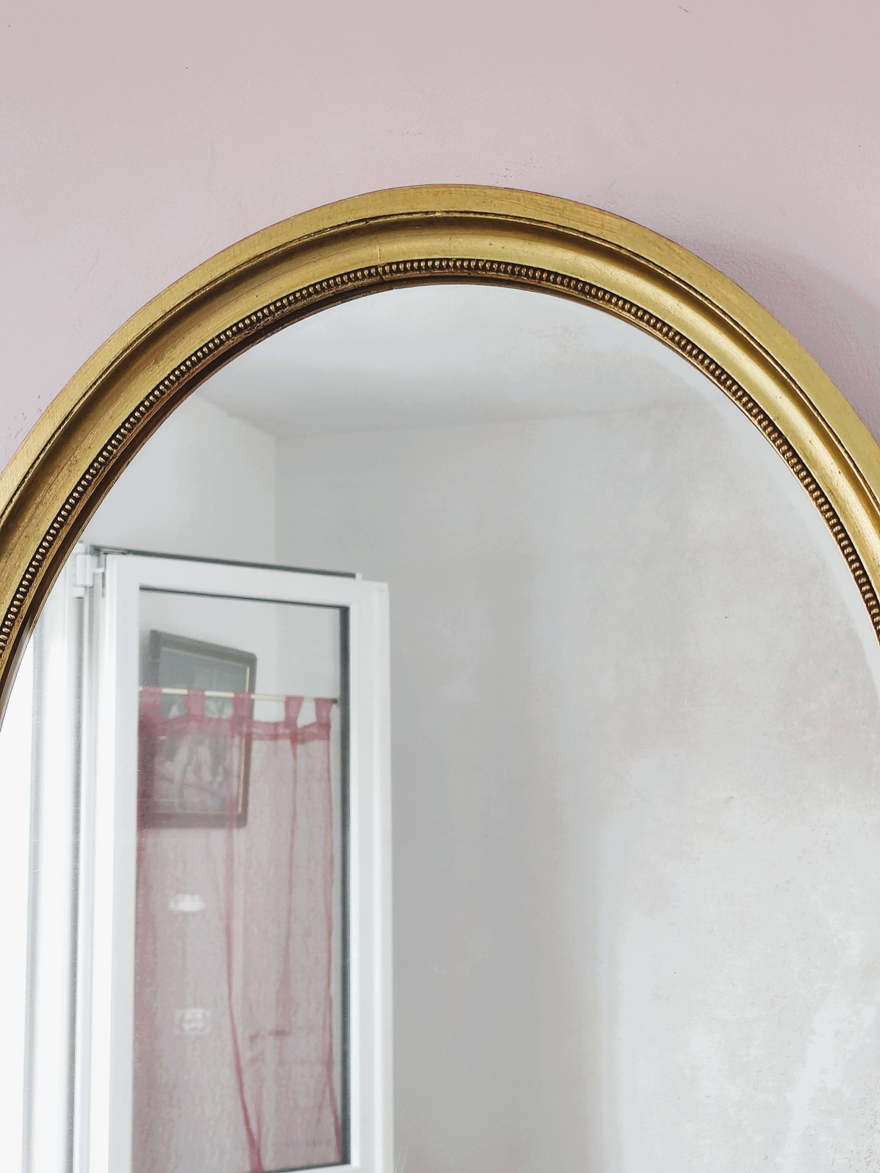 Antique gold oval mirror