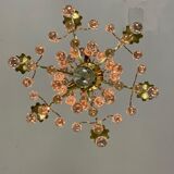 Gilded bronze chandelier trimmed with drop-shaped stamps