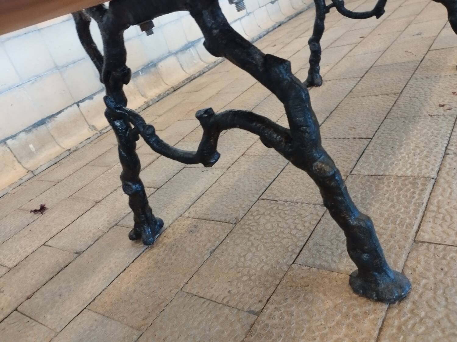 Antique garden bench with cast iron legs