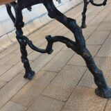 Antique garden bench with cast iron legs