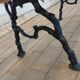 Antique garden bench with cast iron legs