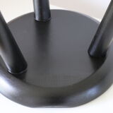 Black tripod wooden stool
