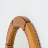 Sculptural wall mirror in solid pine