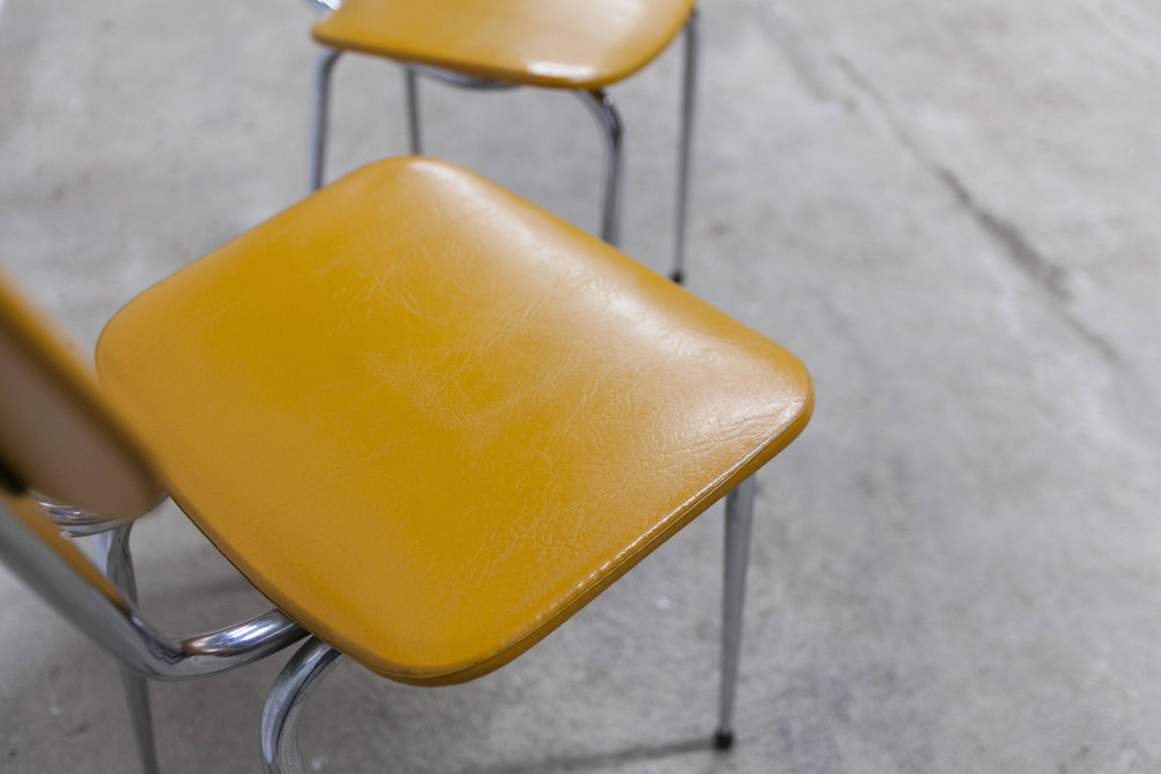Pair of mustard-colored 70s welded Skai chairs