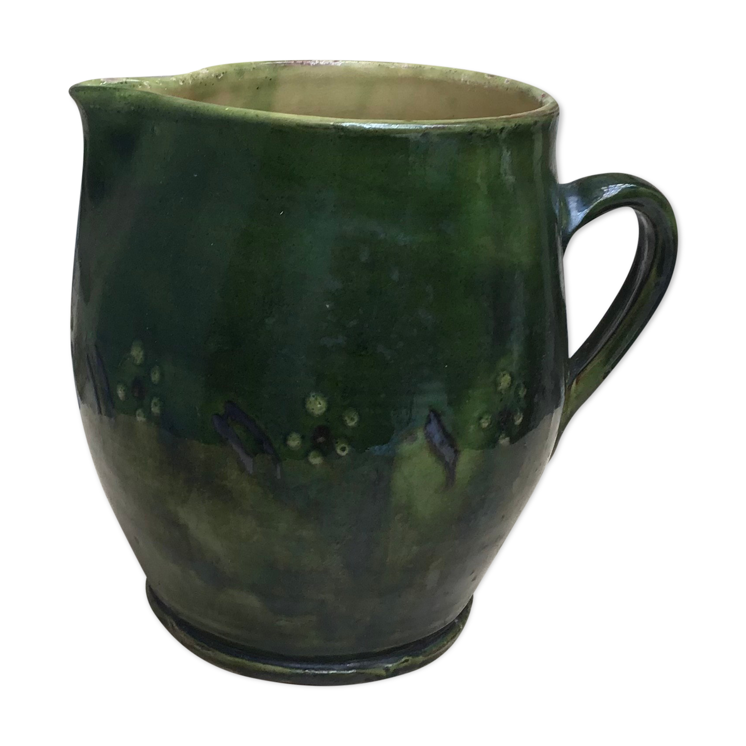 Green varnished earth pitcher with flower pattern