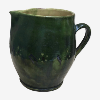 Green varnished earth pitcher with flower pattern