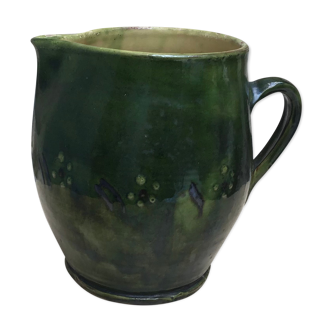 Green varnished earth pitcher with flower pattern