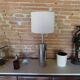 Foot of chrome lamps and ivory white lampshade