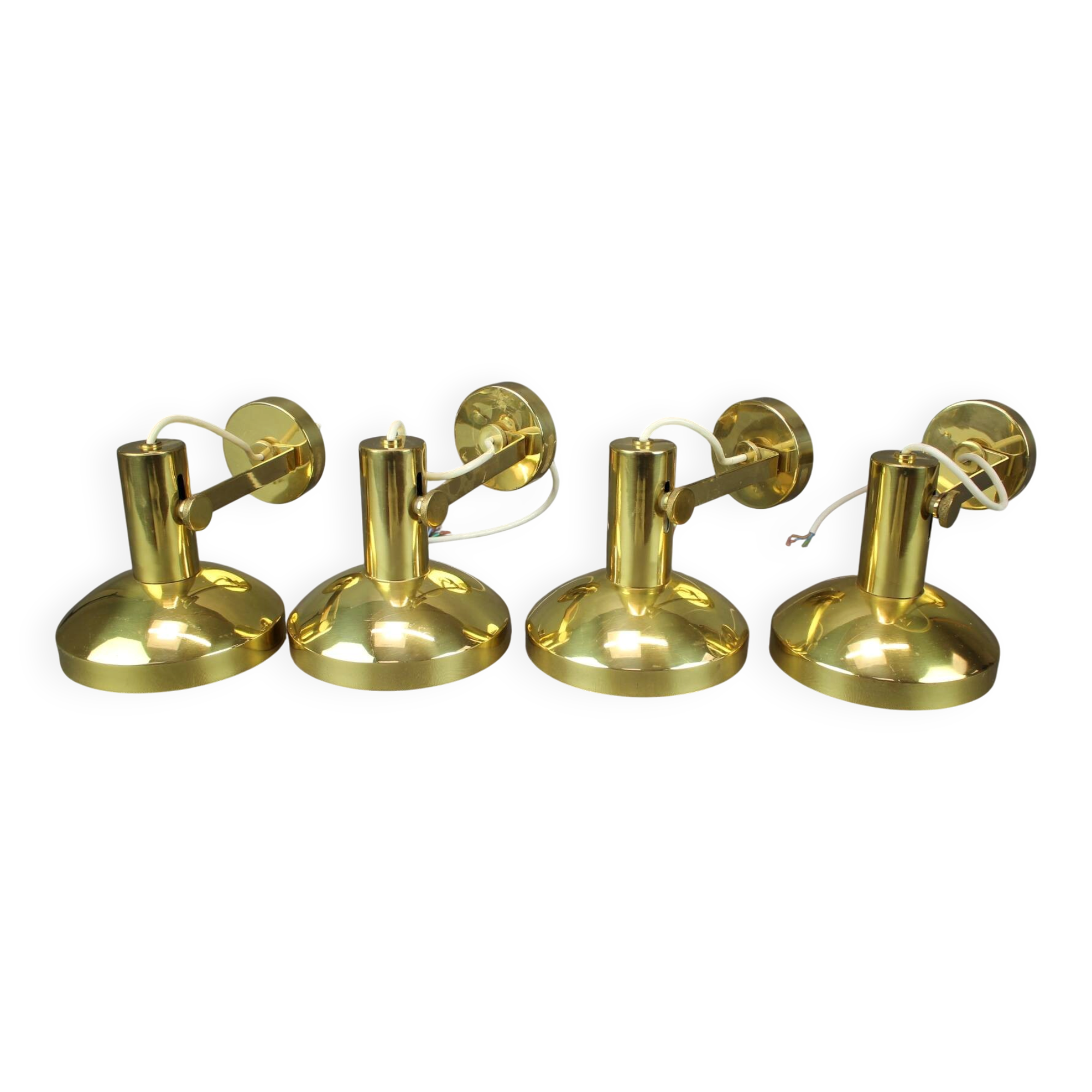 Set of four adjustable brass wall lights, Germany, 1960s.